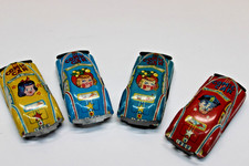  4 VTG 1953 TIN LITHO COMIC CARS, JAPAN, POLICEMAN, GIRLS, YELLOW, RED AND BLUE