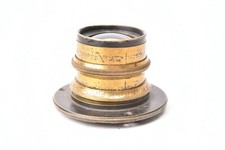 Vintage brass lens. Approximate focal length 150mm.