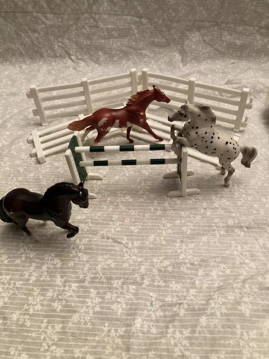 set of 3 mini Breyer horses and jumping set with fence. 3 in. horses. Brown an