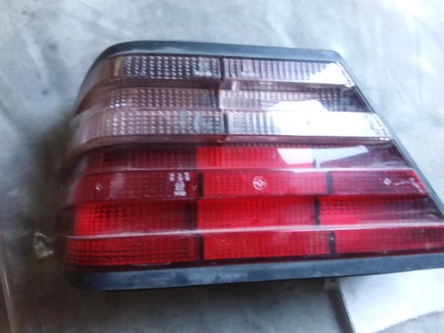 MERCEDES E CLASS LEFT TAILLIGHT W124 SEDAN -TINTED LENS TYPE 02/86-01/96 86 87 8