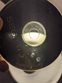 Heart of the Alien (SEGA CD) case and manual. Disc is damaged