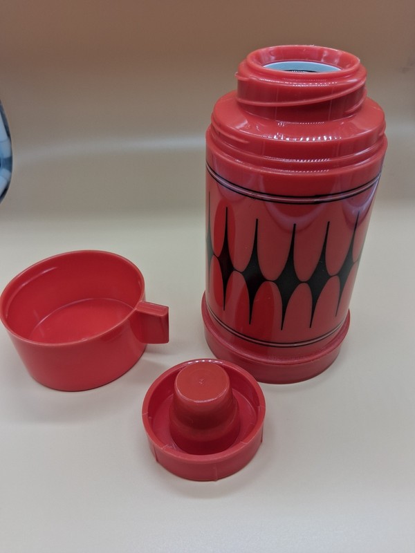 Aladdin Vanguard 3C thermos from the 1970s.It features a distinctive red...