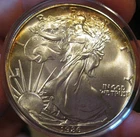 1986 Silver American Eagle (BU), periperal toning both sides, 5201-4