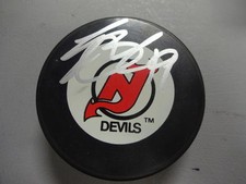 TRAVIS ZAJAC   NEW JERSEY DEVILS SIGNED AUTOGRAPHED HOCKEY PUCK W/ COA 