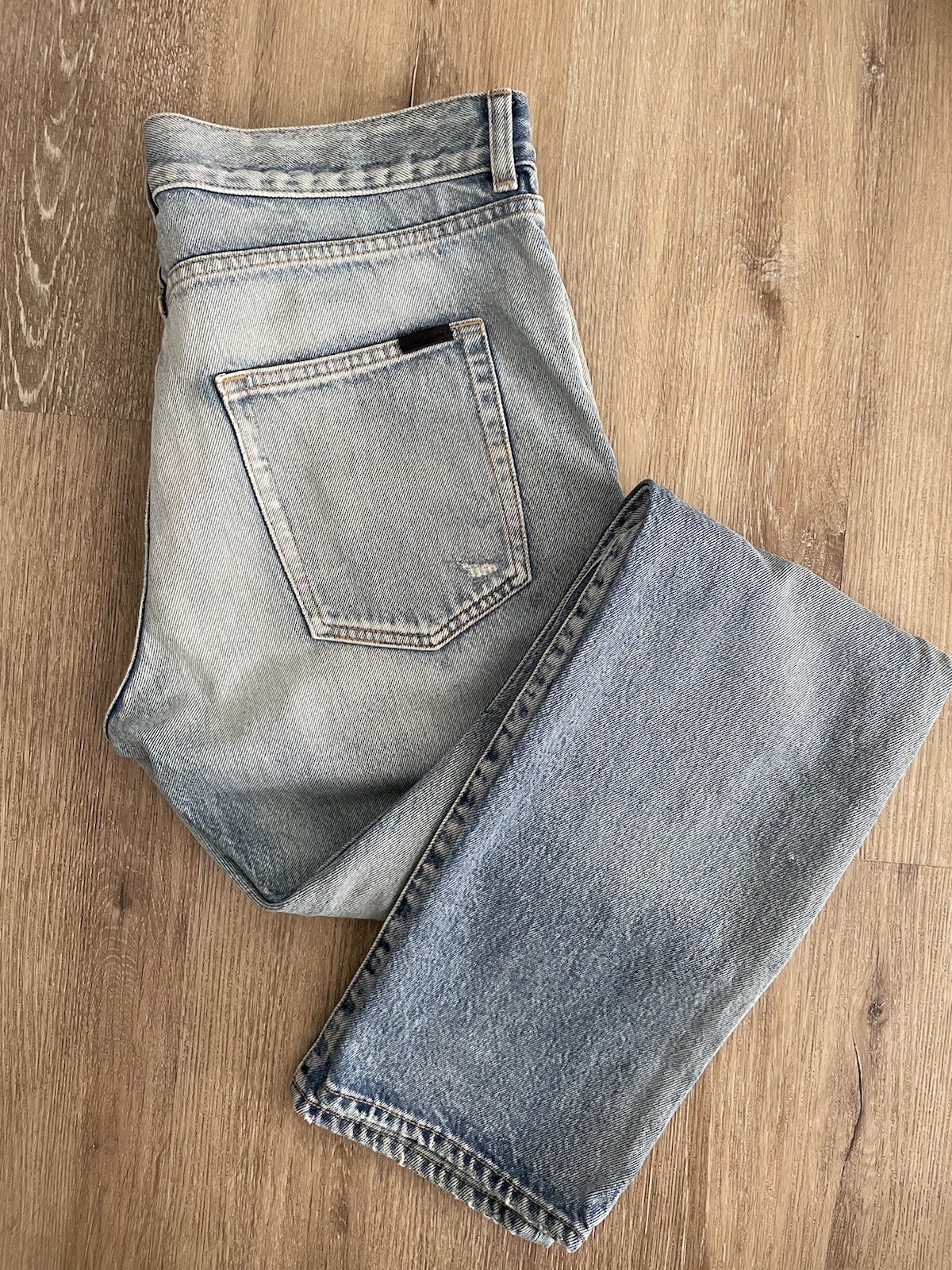 Jeans uomo Saint Laurent slim strappato al ginocchio blu. Taglia 32