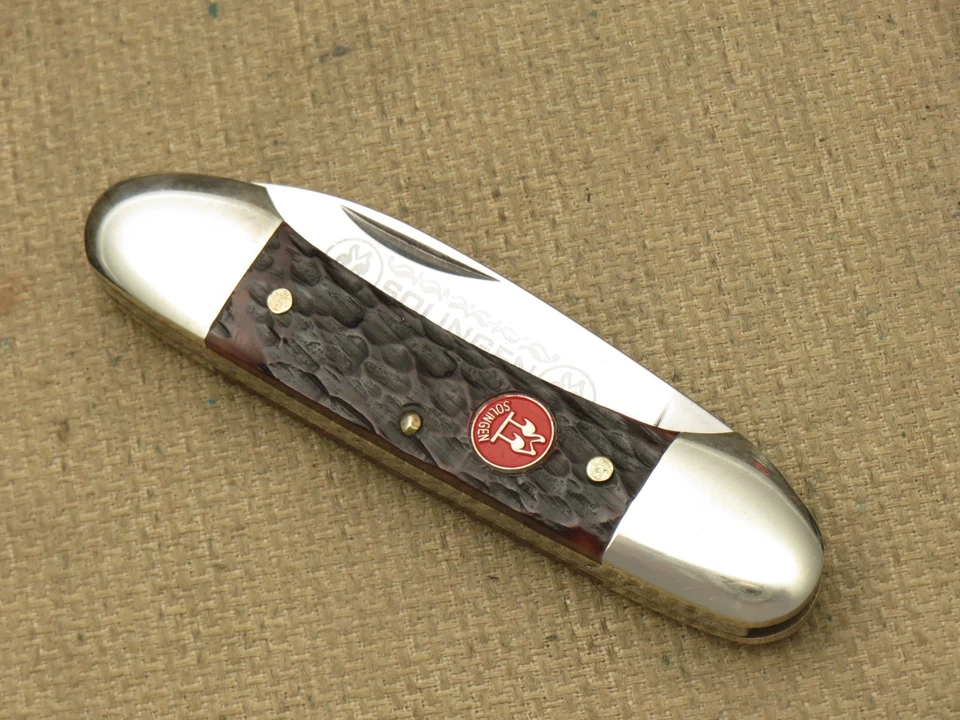 Mini cuchillo de canoa Solingen vintage KISSING CRANE asas de hueso marrón - sin usar Foto 4 de 4