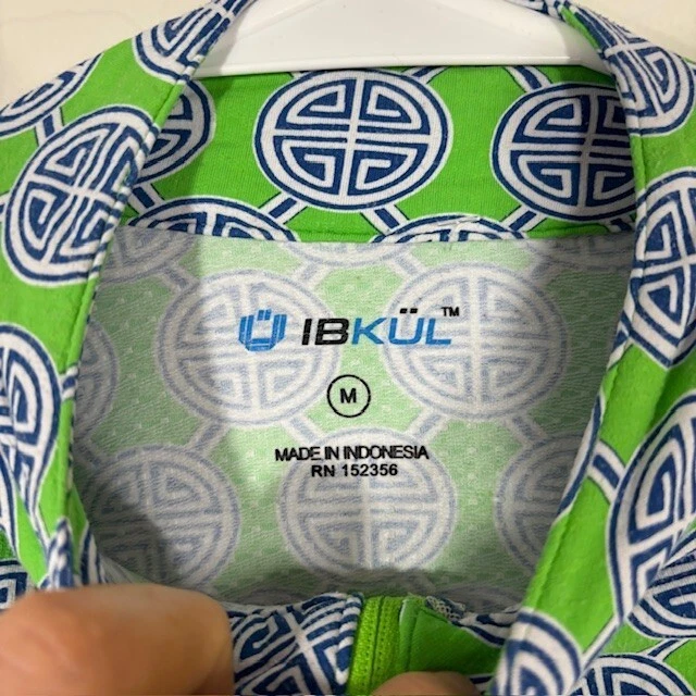 Top de golf IBKUL para mujer manga mediana de malla 1/4 cremallera elástica estampado verde UPF Foto 3 de 4