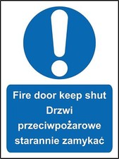 Image of Multilingual sign Fire door keep shut english and polish Safety sign