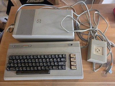 Commodore 64 Console Keyboard and 1541 Disk Drive  both power on cords included