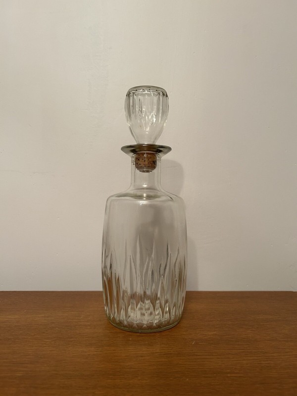 Vintage glass decanter with stopper, embossed ribbed clear glass bottle