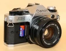 Canon AE-1 Program 35mm Film SLR Silver + FD 50mm f/1.8 Lens - Tested Working