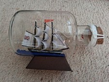 HMS Endeavour  Vintage Glass Ship In Glass Bottle 14cm x 7cm dia on wooden base