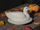 Vintage Westmoreland milk glass duck on a nest with amber eyes