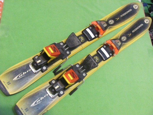 Sci da neve Rossignol Cobra J Junior con attacchi Salomon 80 cm Jr nero e giallo
