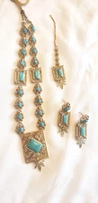 Beautiful necklace with matching earings and tikka in turquoise color