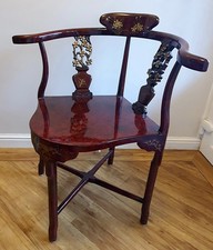 red and gold lacquer corner chair