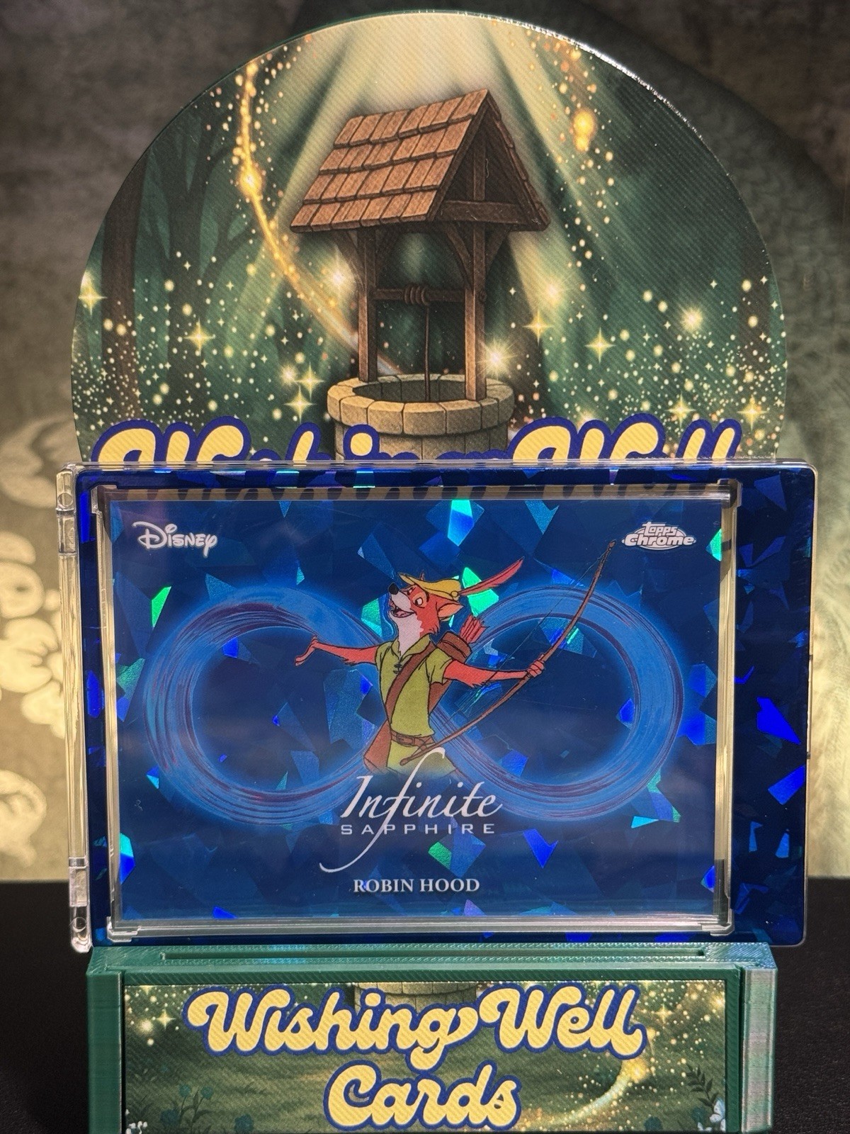 Robin Hood #IS-3 2026 Topps Chrome Sapphire Disney Infinite trading card — raw and PSA graded price guide