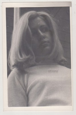 Beautiful Blonde Girl Looking Down In Silence While Her Thoughts Stay Far Away