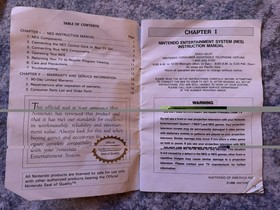 Nintendo NES with 12 games, 2 controllers, game pad, & zapper. Great condition!!