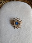 vintage Gold Tone Starburst Flower Brooch Pin Blue Round Center Stone — photo 1