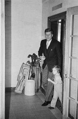 President John Kennedy escorts daughter Caroline from an eleva- 1961 Old Photo