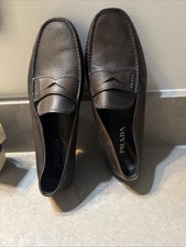 brown leather Prada loafer shoes.