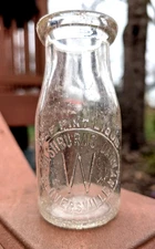 Embossed WASHBURN'S DAIRY, GLOVERSVILLE, NY MILK Half Pint Milk Bottle Washburn