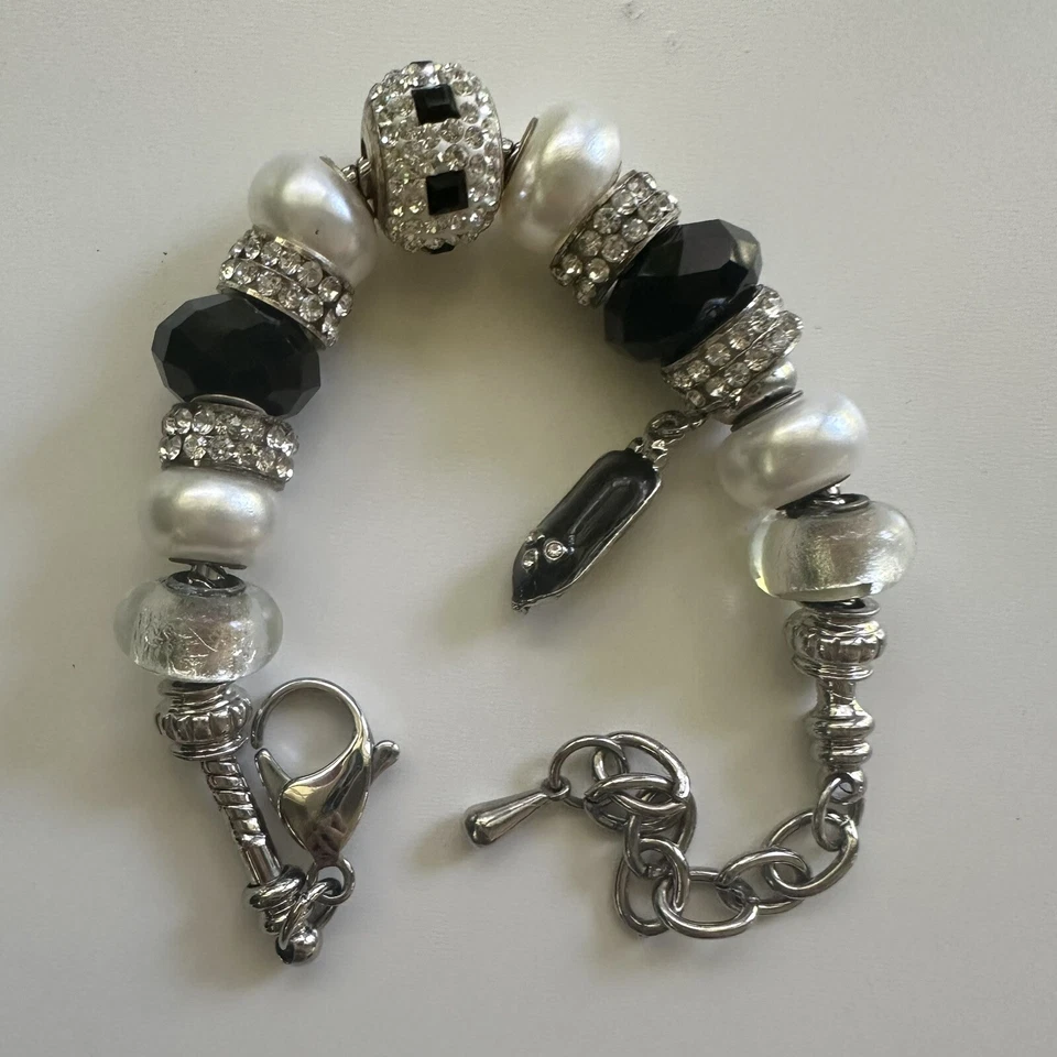 Pulsera Bella Perlina Vintage Tonificada Negra Y Astilla Con Dije Barco Foto 4 de 4