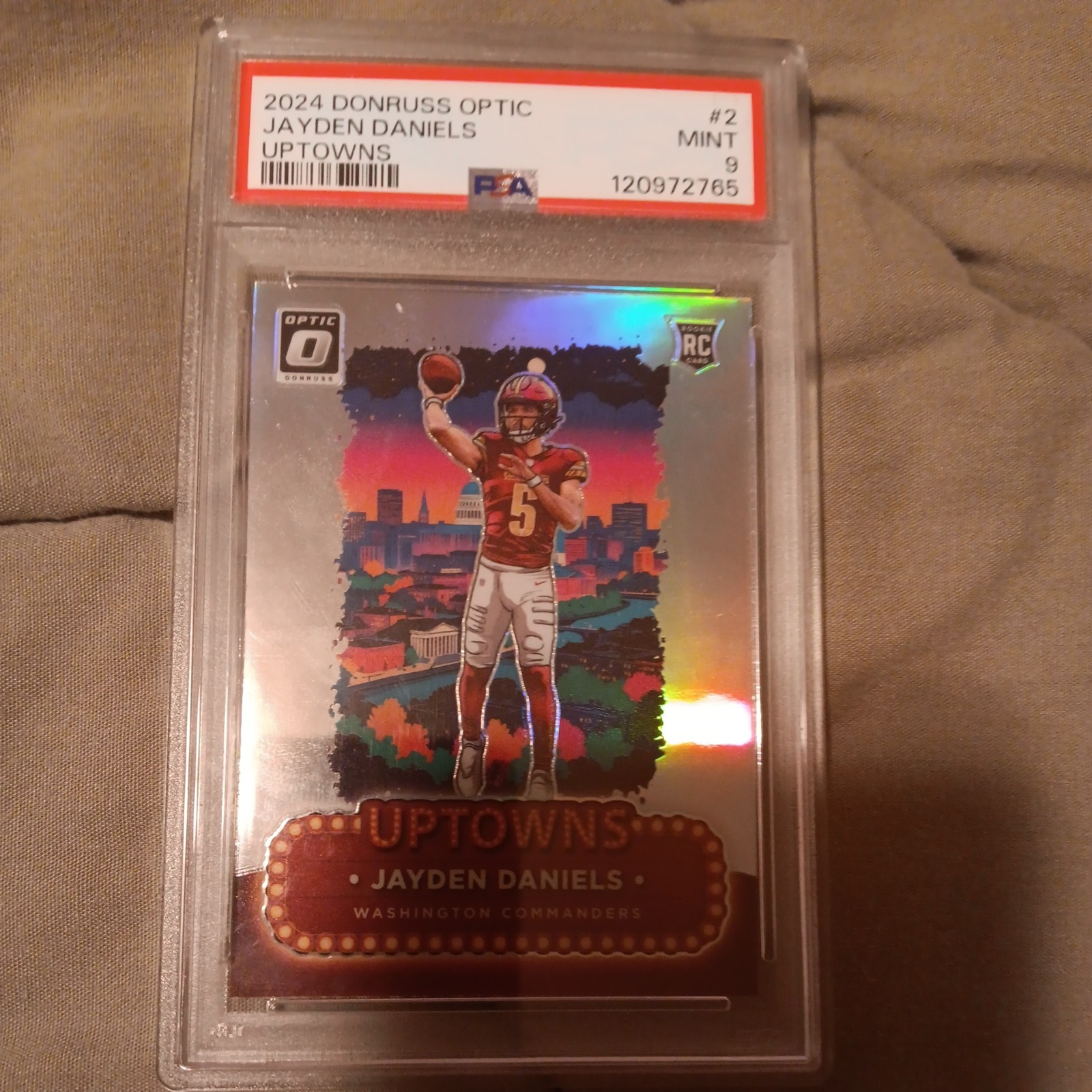 2024 Panini Donruss Optic Uptowns Jayden Daniels #2 RC Commanders PSA 9 view 2
