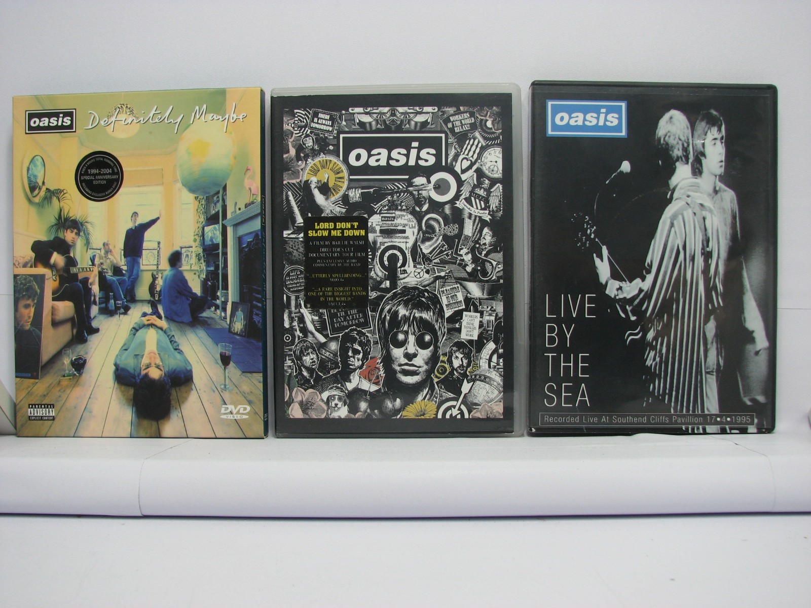 Oasis 3 x DVD Bundle. Definitely Maybe, Live By The Sea, Lord Don't Slow Me Down