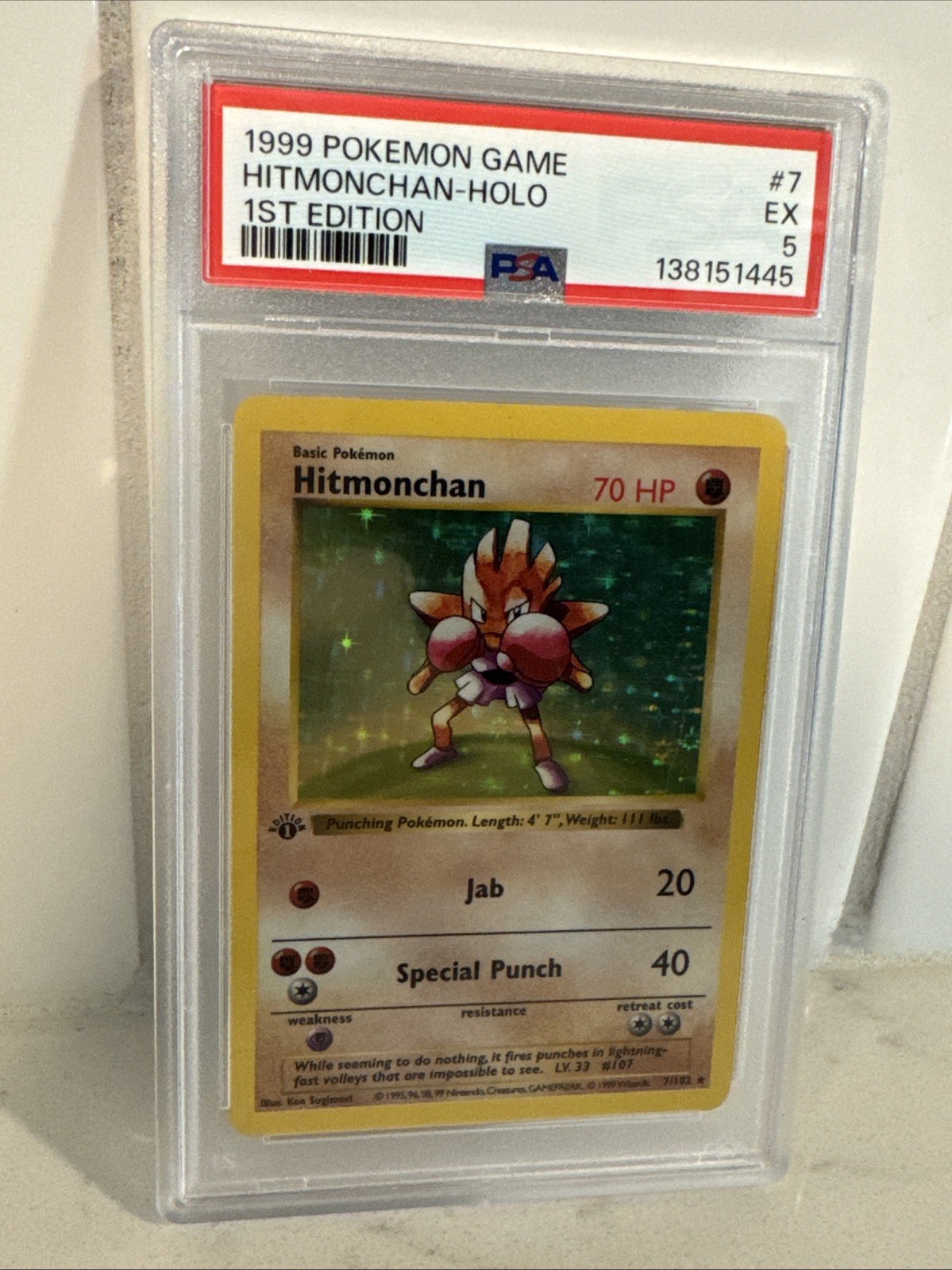 1999 POKEMON BASE SET 1ST EDITION #7 HITMONCHAN-HOLO PSA 5