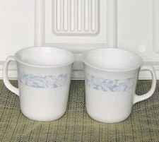 2 Corelle “Morning Light” Light Blue & Beige Floral Ribbon Trim Mugs