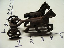 cast iron pair of horses and front of wagon, partial red paint