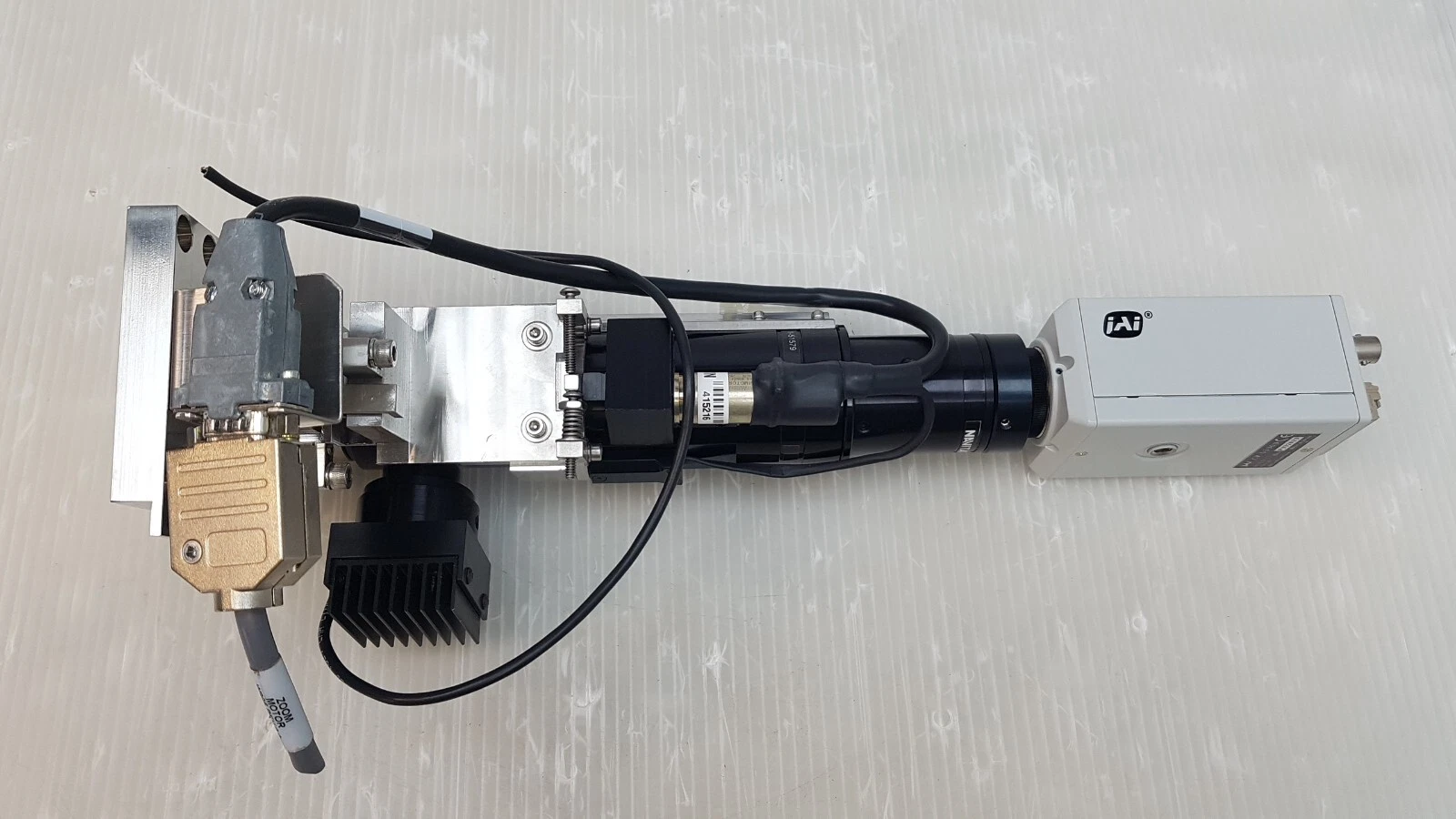 Underside of the Navitar zoom assembly with D-sub hoods and ZOOM MOTOR cable