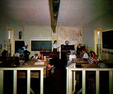 Vintage Postcard Pioneer School House in Early 20th Century Classroom Scene