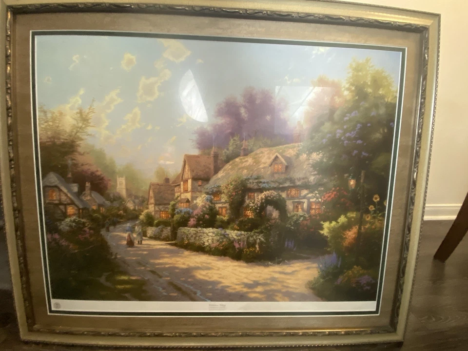 "Cobblestone Village" es una pintura de Thomas Kinkade/34 pulgadas de ancho x 28 pulgadas de alto Foto 2 de 3