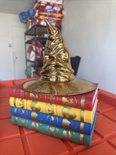 Harry Potter 25th Anniversary House Book Gold Sorting Hat Popcorn Bucket in hand