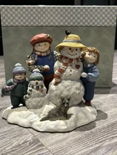 Lang Wise Snow Mom With Children, Snowman And Dog