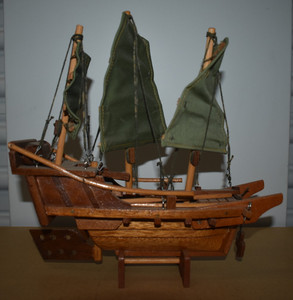 antique wooden boat on stand