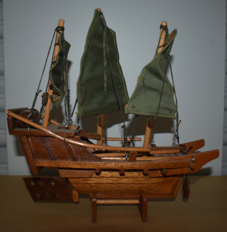 antique wooden boat on stand