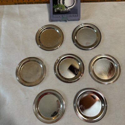 Set Versilberte Untersetzer von Tchibo. Silver Plated Coasters. 7 Total. Transla