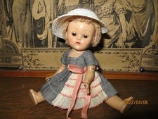 Small white straw hat with open crown and bow