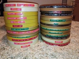24 x 7" reel cases WITH film (may contain wrestling travel pets see desc. BoxC