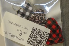 New pierced earrings, still in original package. Dangled, 3 pieces, heart shape