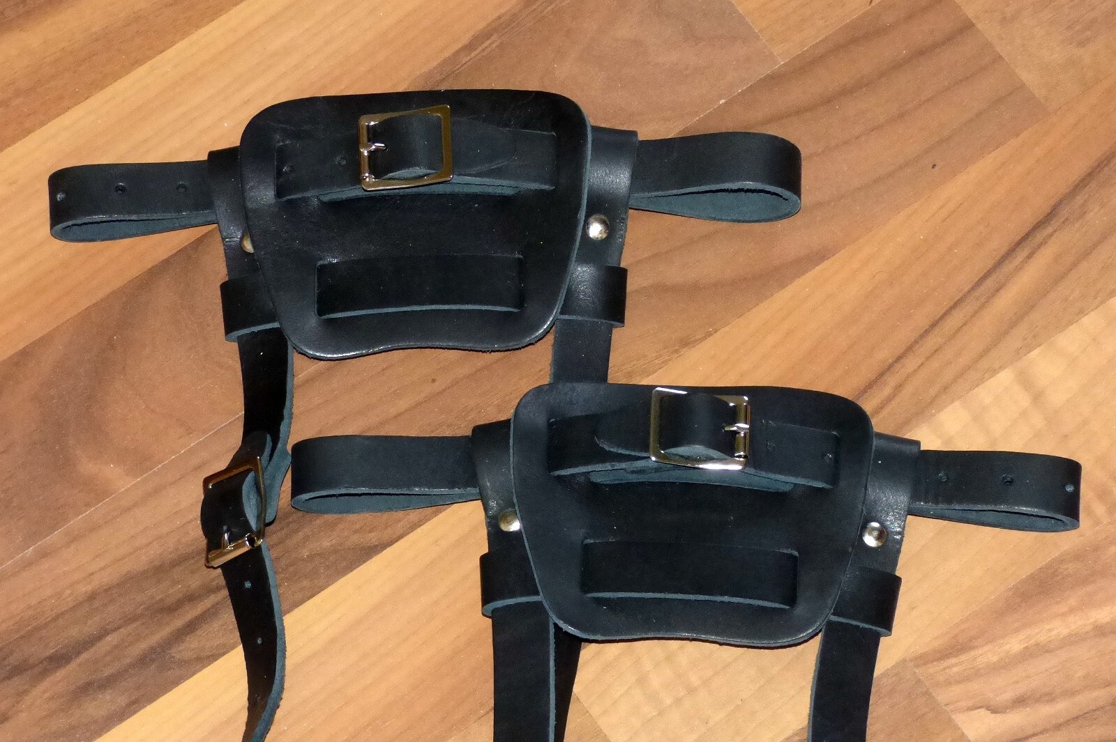 Brand new pair of black colored leather bindings for snowshoes