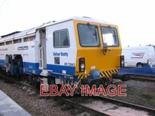 PHOTO  DR 73943 - PLASSER & THEURER TAMPER/LINER (DETAIL)  TAMPING MACHINES ARE