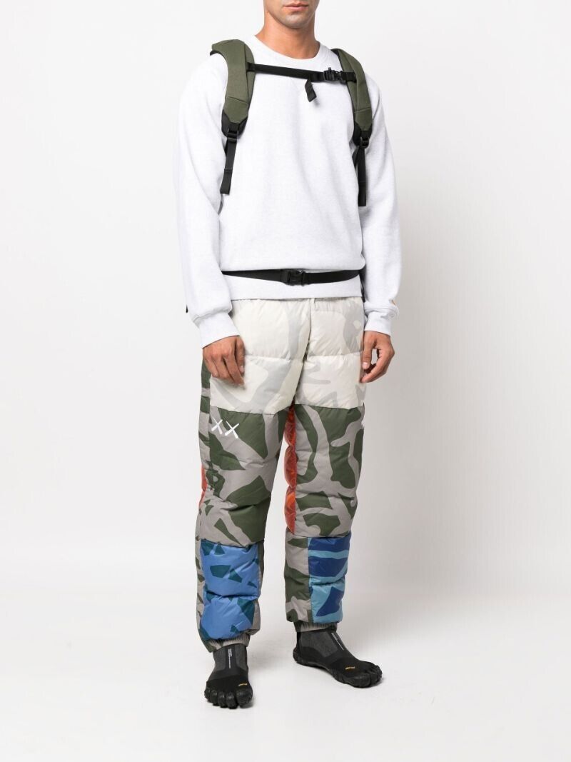 NWT MENS THE NORTH FACE x KAWS 1996 RETRO NUPTSE TROUSER NWT MENS THE NORTH FACE x KAWS 1996 RETRO NUPTSE TROUSER