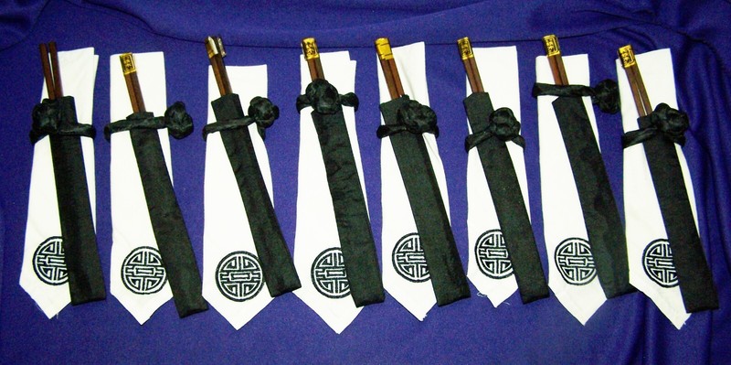 Eight White Asian Napkins with Wooden Chopsticks contained in Fabric Sheath