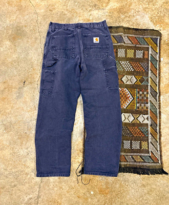 Vintage style navy blue sun faded Carhartt carpenter jeans