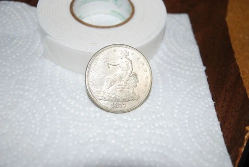 1877 SILVER TRADE DOLLAR 900 FINE AND FINE CONDITION